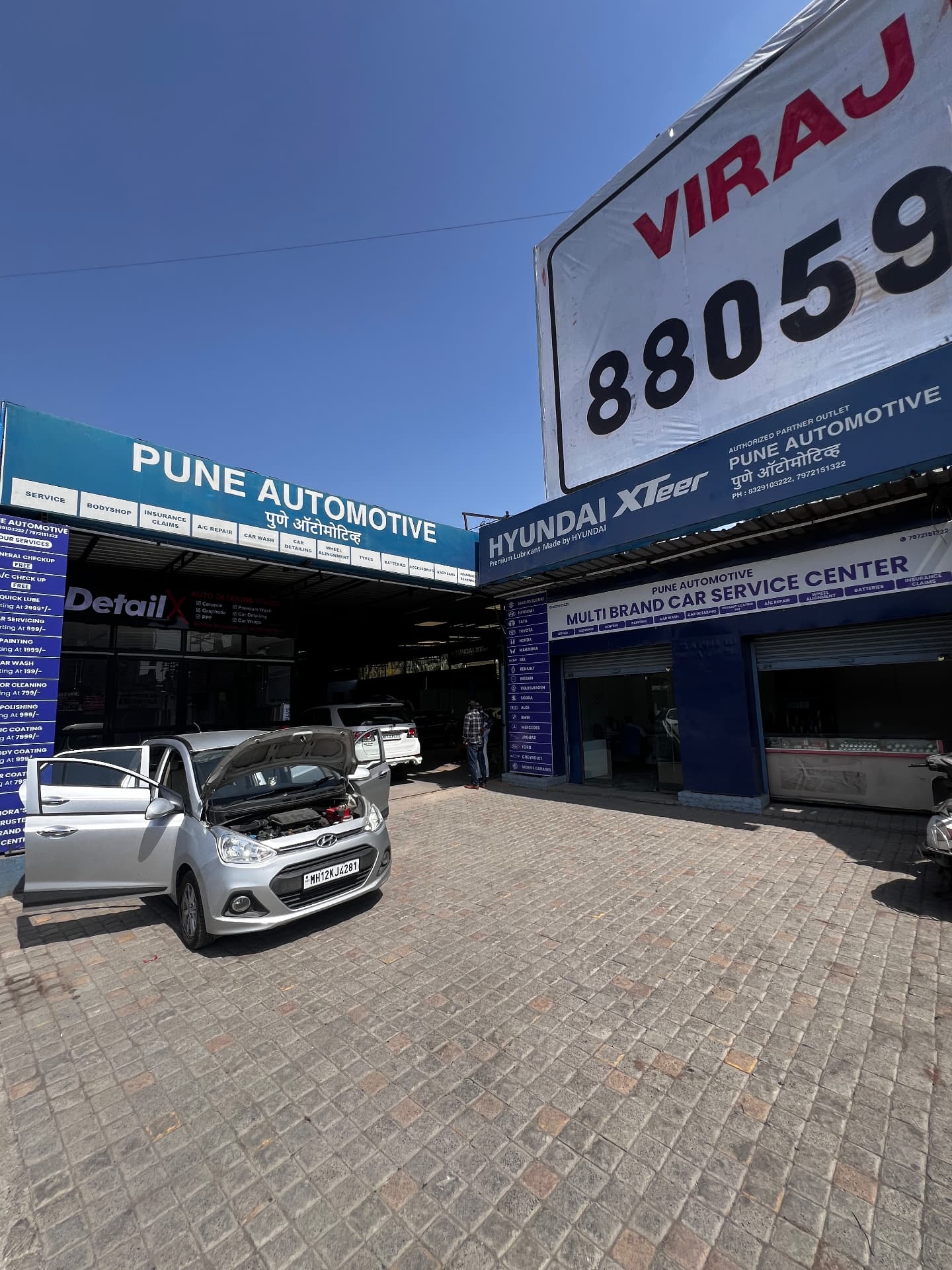 Pune Automotive multi-brand car service centre frontage in Hadapsar, Pune with a Hyundai in the open service bay